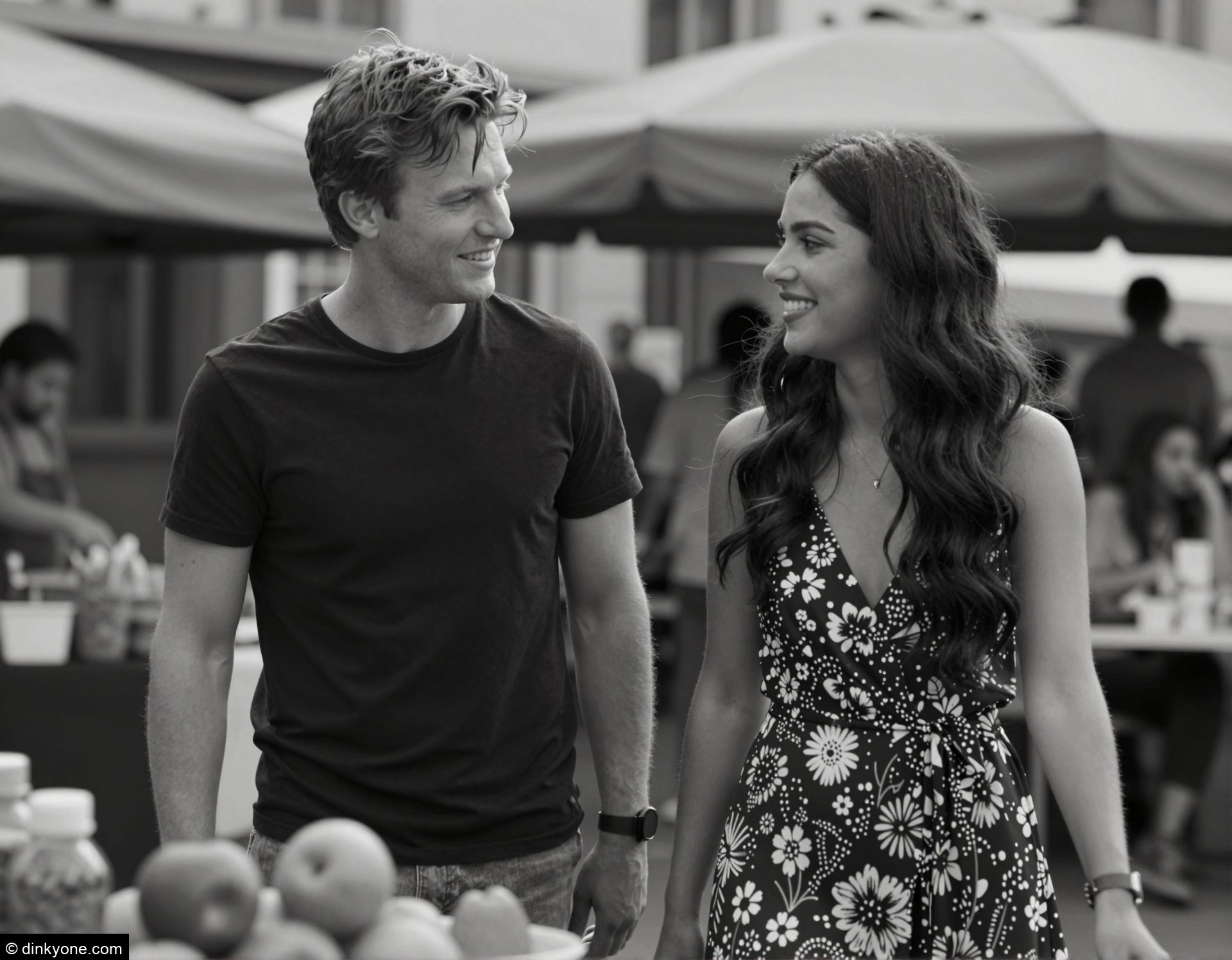 A young couple at an outdoor street food market.